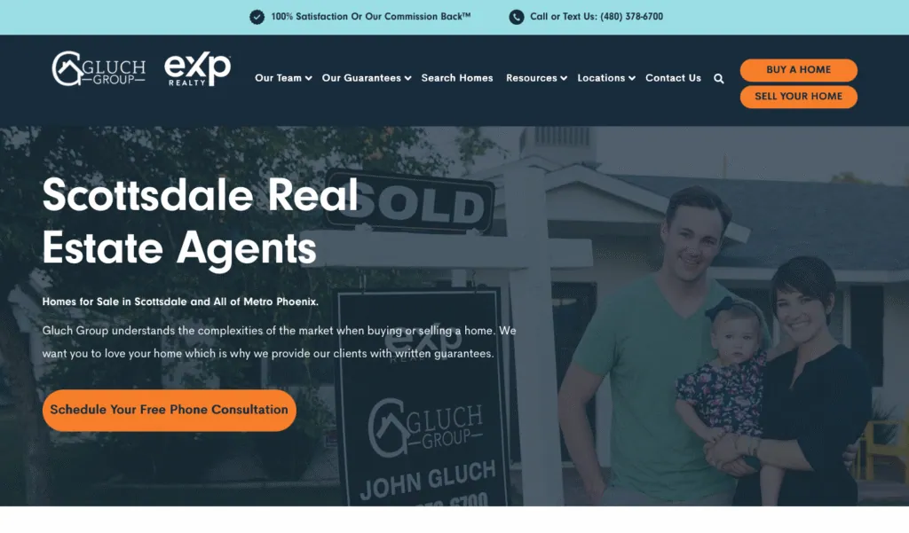 Gluch Group real estate website shown on a laptop
